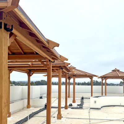 Hot Tub Enclosure Kits / Hot Tub Pavilion (Options: 10' x 10' & 12' x 12', Shiplap Roof Out of California Redwood and the Rest of the Structure in Douglas-fir, Without Skylight, 1 Ceiling Fan Base, Without Windows, 4 Curtain Rod, 4-Post Kit for Concrete, Transparent Premium Sealant). Pavilions are installed on the rooftop of La Bahia Hotel & Spa in Santa Cruz, CA.